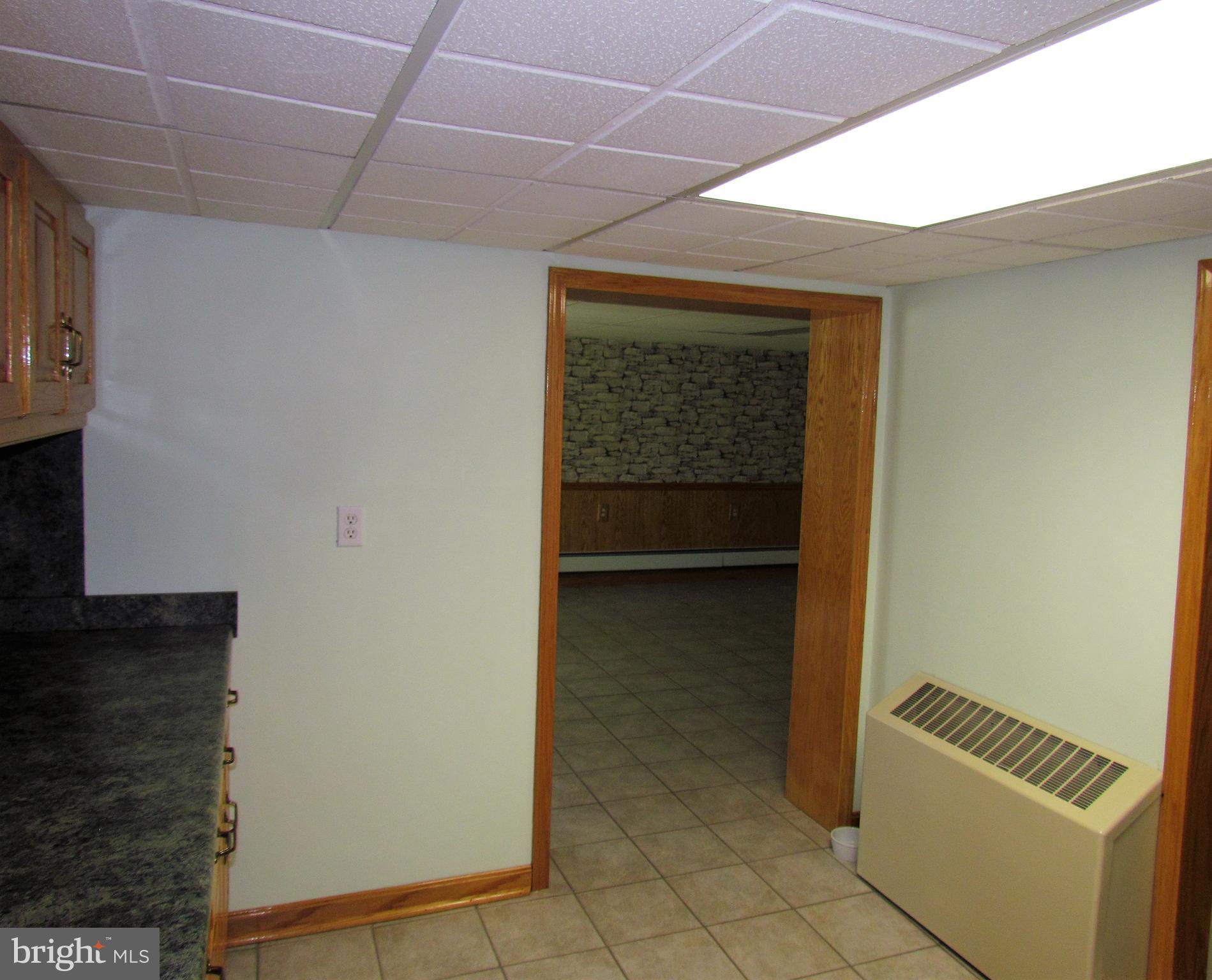 6442 Mt Phillip Road Frederick, MD 21703 - Photo 19 of 37 a view of an empty room with a fireplace and a window