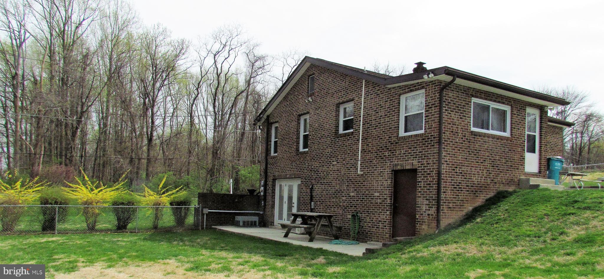 6442 Mt Phillip Road Frederick, MD 21703 - Photo 25 of 37 a front view of a house with garden