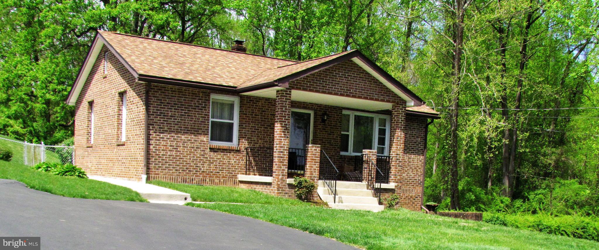 6442 Mt Phillip Road Frederick, MD 21703 - Photo 36 of 37 front view of a house with a yard