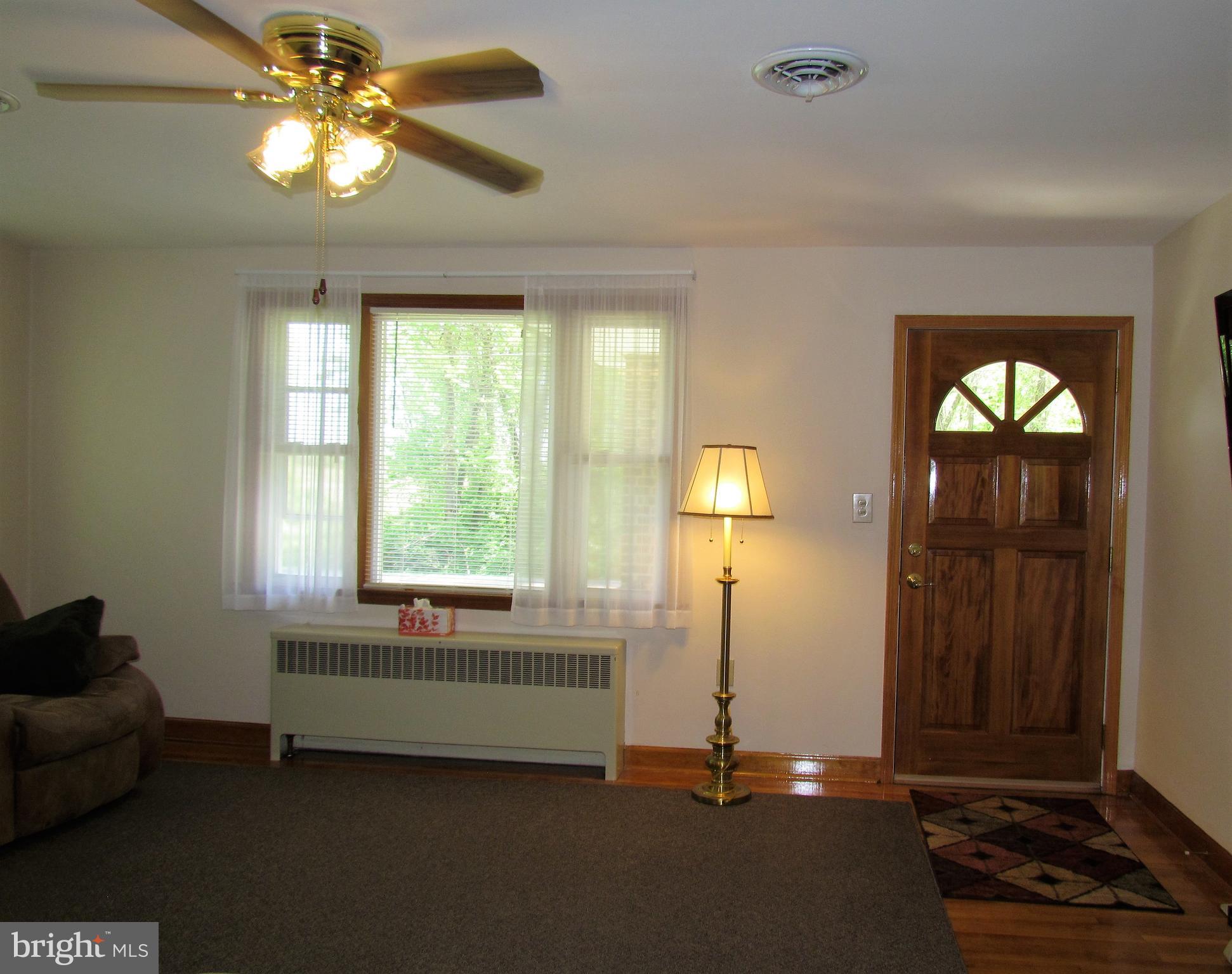 6442 Mt Phillip Road Frederick, MD 21703 - Photo 6 of 37 a view of a livingroom with furniture and windows