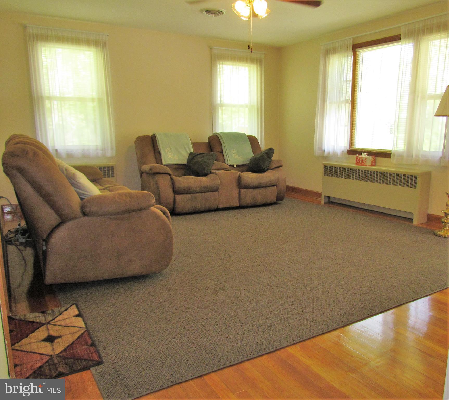6442 Mt Phillip Road Frederick, MD 21703 - Photo 7 of 37 a living room with furniture and a large window