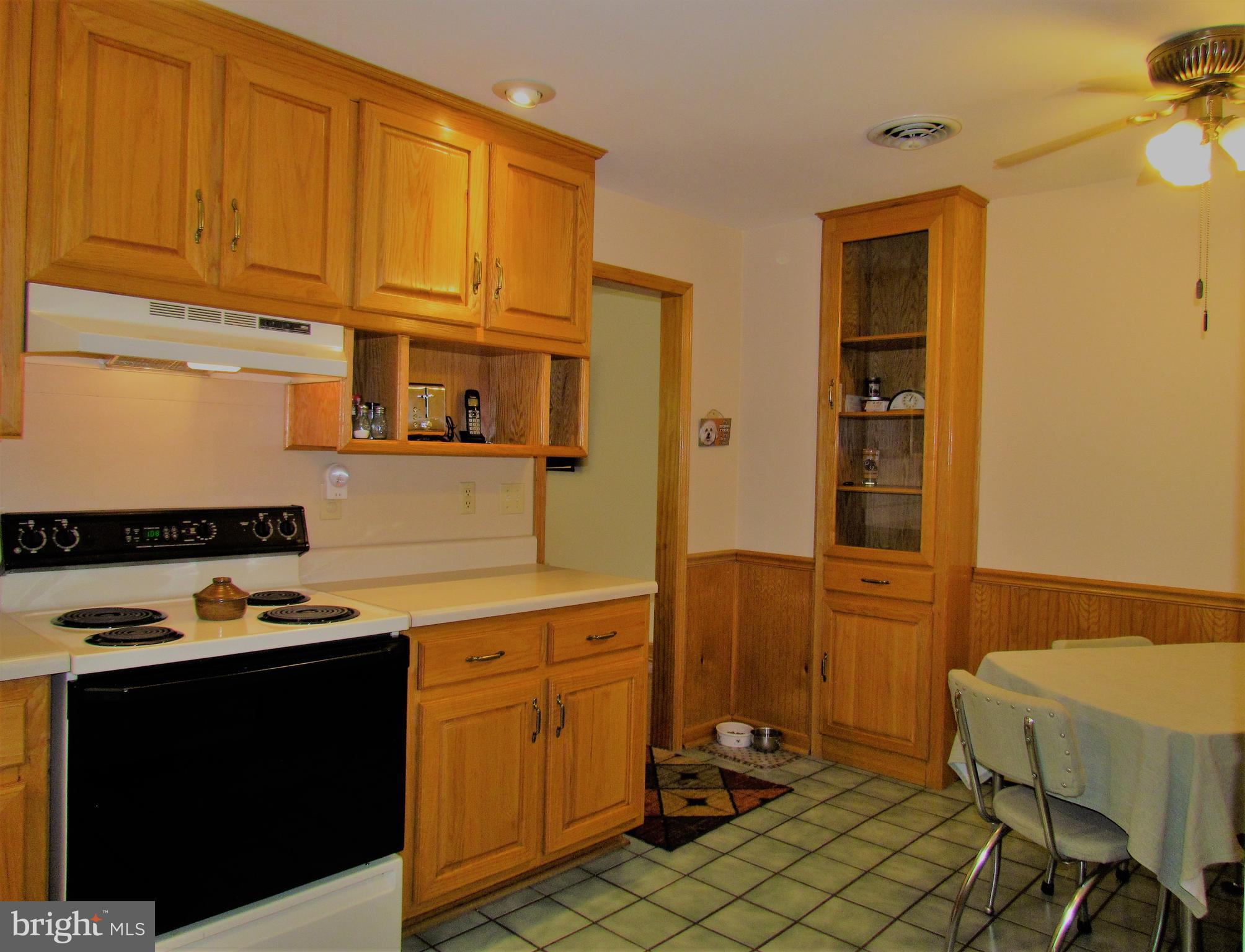 6442 Mt Phillip Road Frederick, MD 21703 - Photo 9 of 37 a kitchen with a cabinets and appliances