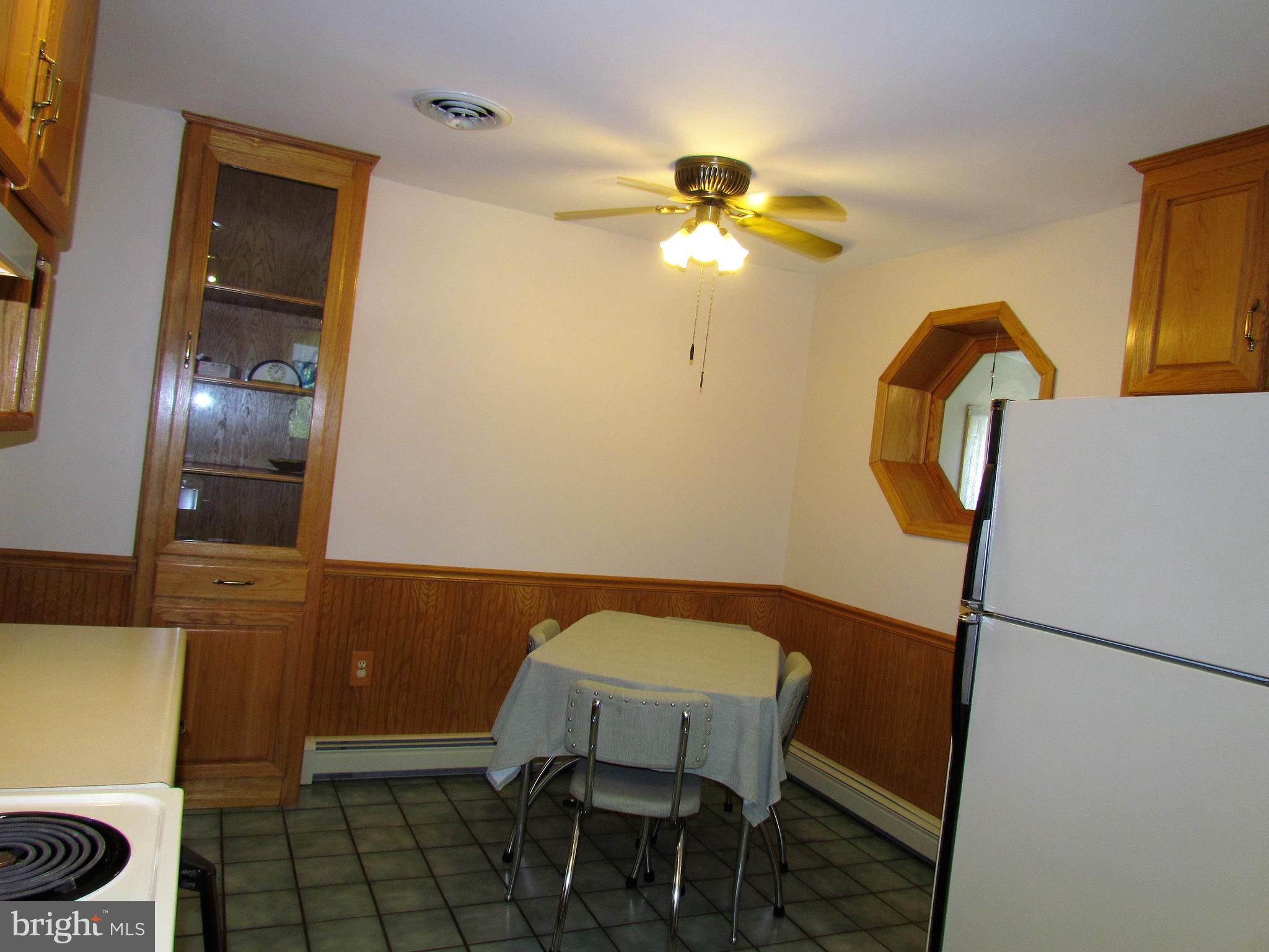 6442 Mt Phillip Road Frederick, MD 21703 - Photo 10 of 37 a view of a dining room with furniture and chandelier