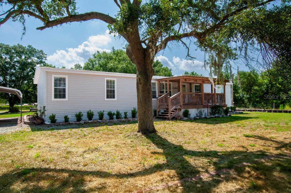 a view of a house with snow in the yard