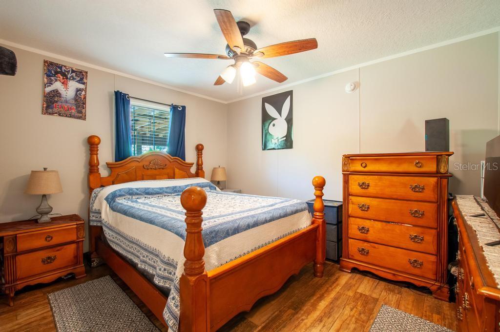1264 Northeast Forrest Avenue Arcadia, FL 34266 - Photo 14 of 25 a bed room with a bed and a dresser