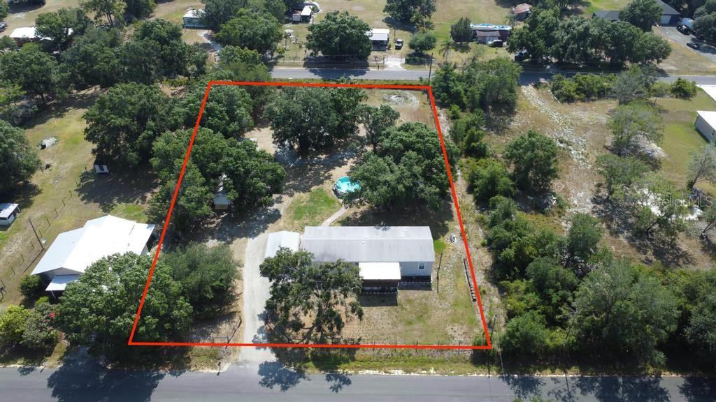 1264 Northeast Forrest Avenue Arcadia, FL 34266 - Photo 2 of 25 an aerial view of a house with yard swimming pool and outdoor seating