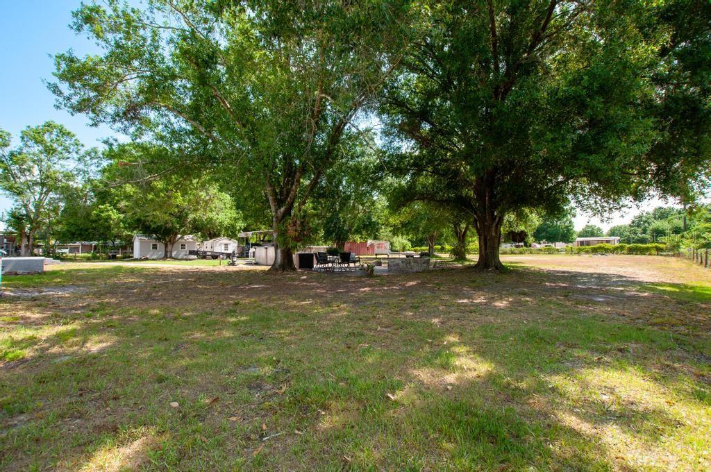 1264 Northeast Forrest Avenue Arcadia, FL 34266 - Photo 21 of 25 a view of road with trees
