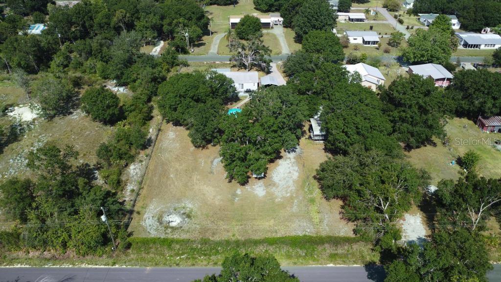 1264 Northeast Forrest Avenue Arcadia, FL 34266 - Photo 25 of 25 an aerial view of residential houses with outdoor space and trees all around