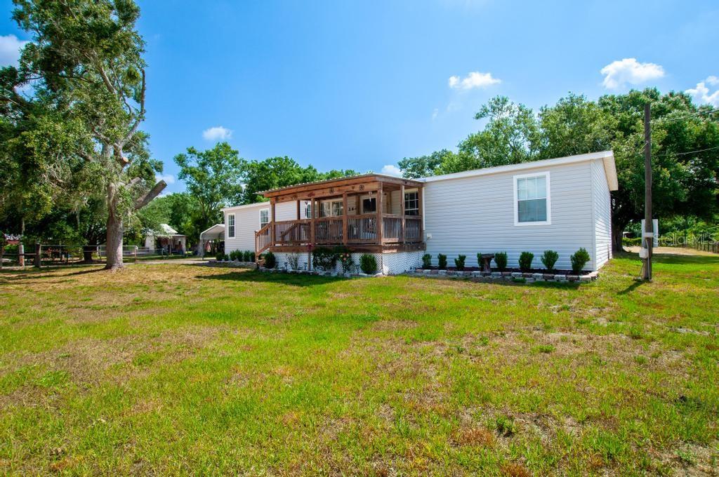 1264 Northeast Forrest Avenue Arcadia, FL 34266 - Photo 5 of 25 a view of a house with a yard