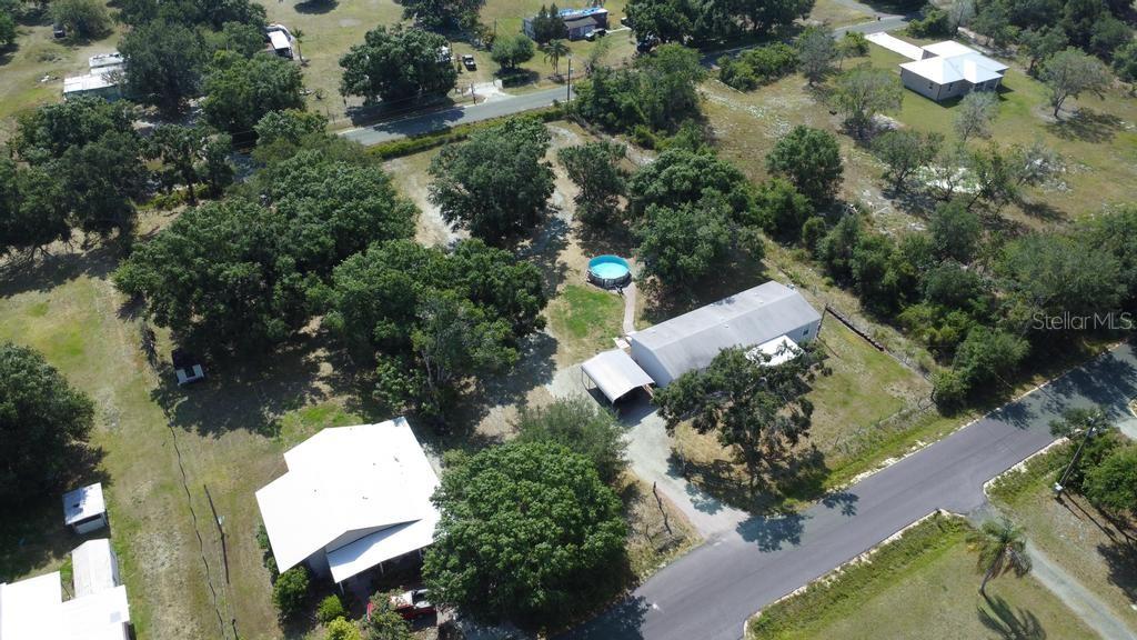1264 Northeast Forrest Avenue Arcadia, FL 34266 - Photo 6 of 25 an aerial view of a house with a yard and lake view