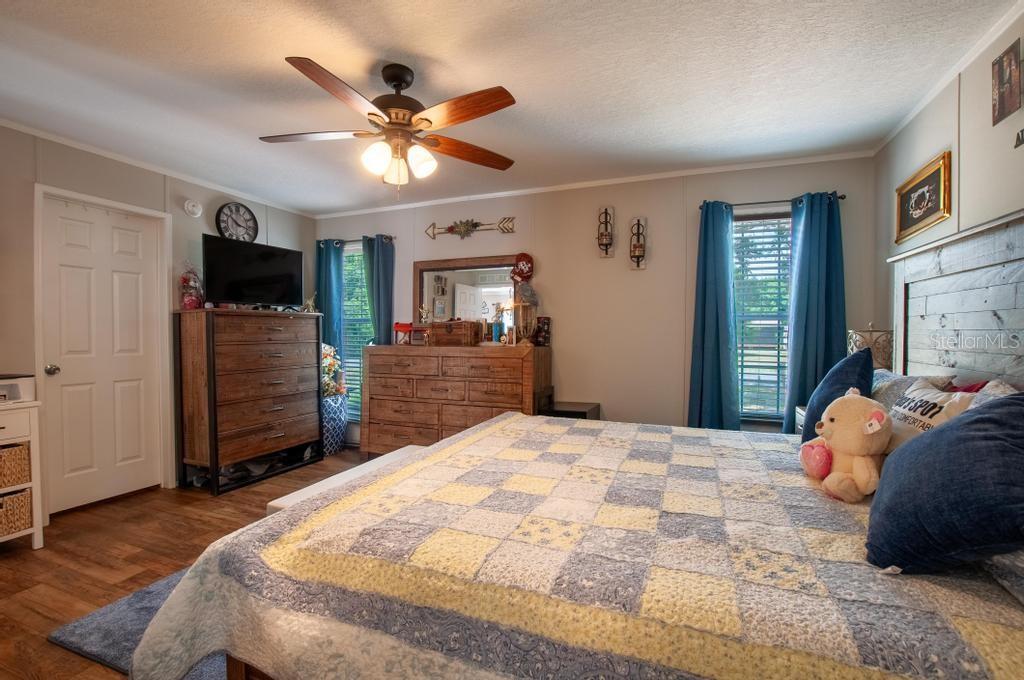 1264 Northeast Forrest Avenue Arcadia, FL 34266 - Photo 7 of 25 a bedroom with a bed and a television