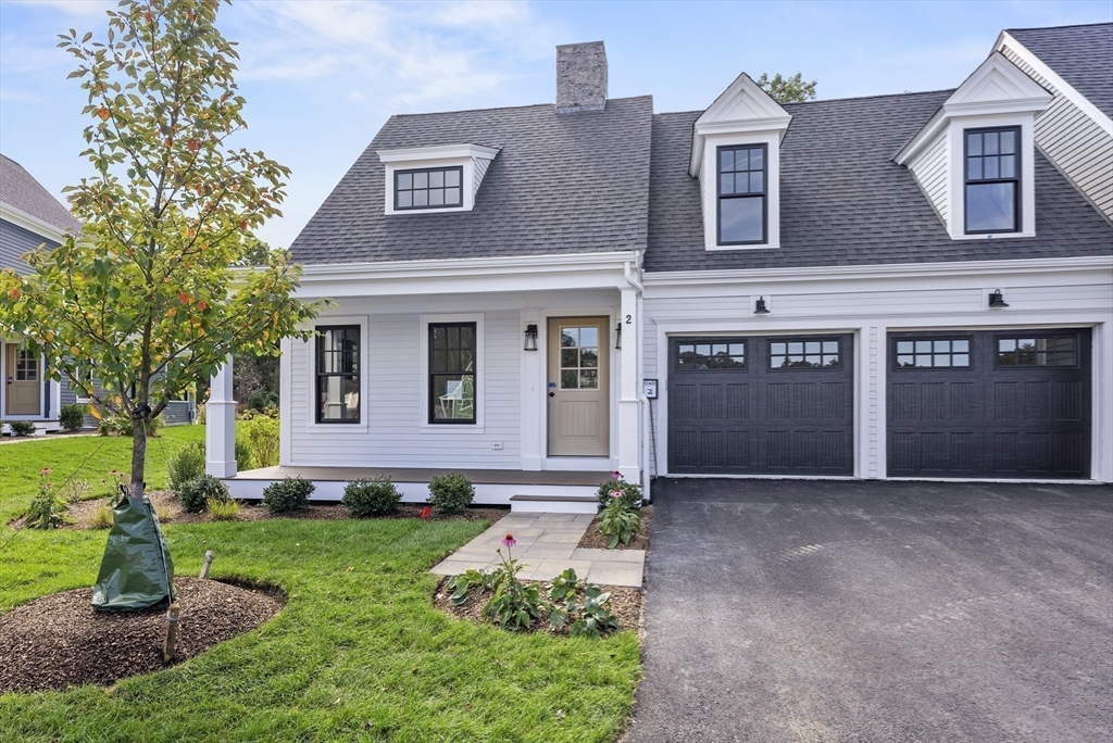 46 Sandwich Road, Unit 26 Plymouth, MA 02360 - Photo 35 of 41 a front view of a house with garden