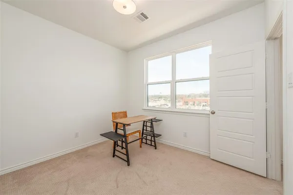 a room with a table and a workspace