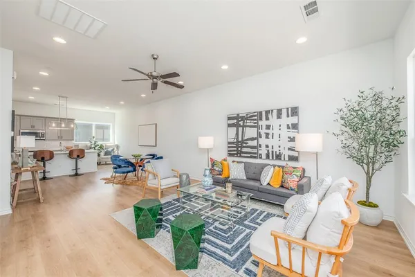 a living room with furniture and a rug