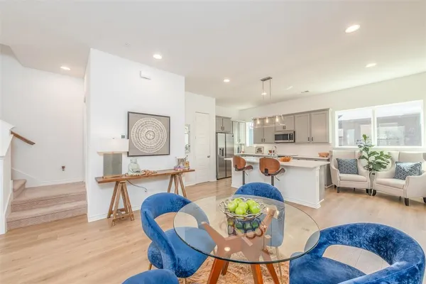 a view of a dining room with furniture window and wooden floor