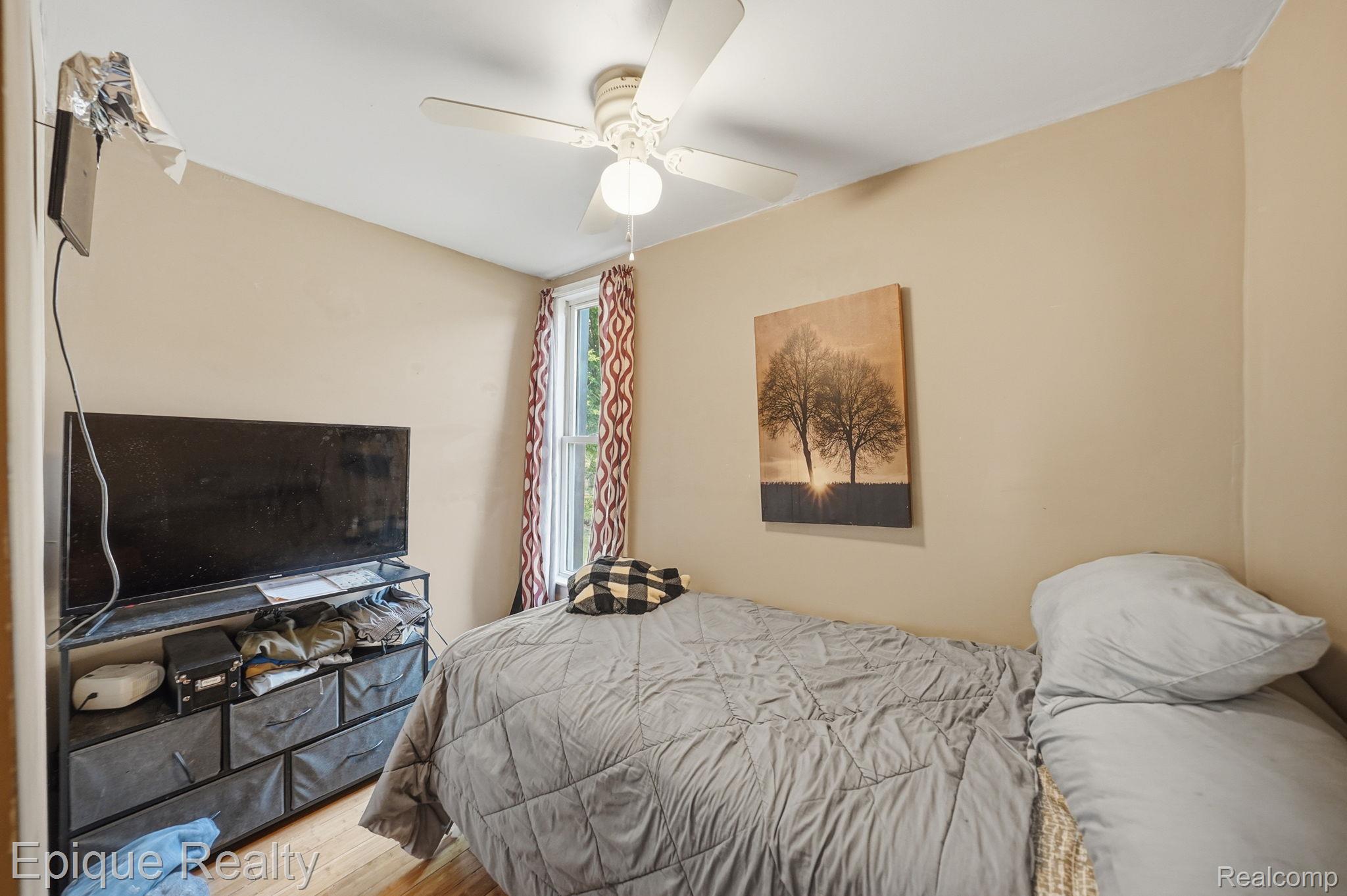 75 East Cicotte Street River Rouge, MI 48218 - Photo 14 of 25 Neutral-toned walls complement wood-finish flooring in this room