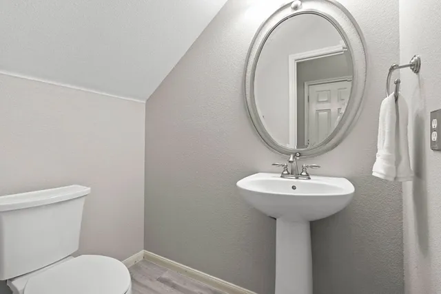 a view of an empty room with a ceiling fan