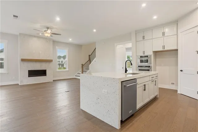 a kitchen with cabinets a sink and a stove