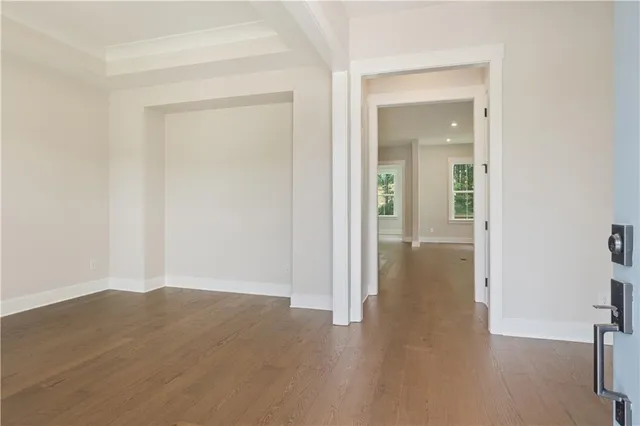 wooden floor in a hall with an empty room