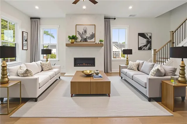 a living room with furniture and a fireplace