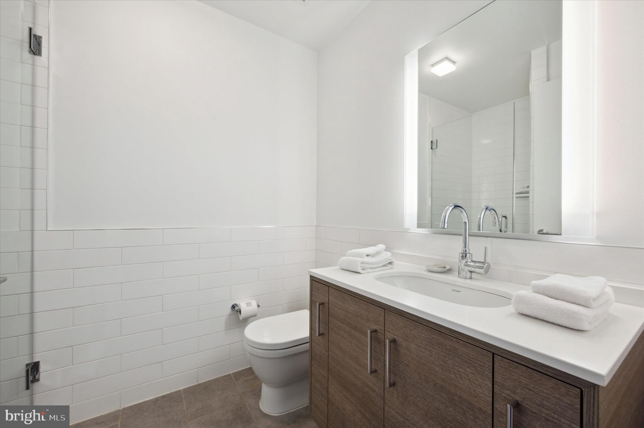 2930 Walnut Street, Unit 3811 Philadelphia, PA 19104 - Photo 22 of 33 a bathroom with a sink and a mirror