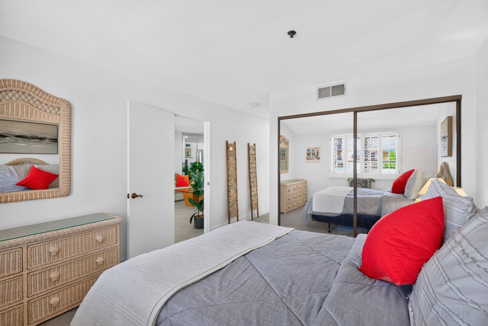 500 East Amado Road, Unit 313 Palm Springs, CA 92262 - Photo 16 of 32 a bedroom with bed and walk in closet