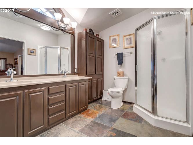 27080 Northwest Olson Road Gaston, OR 97119 - Photo 14 of 32 a bathroom with a double vanity sink toilet and shower