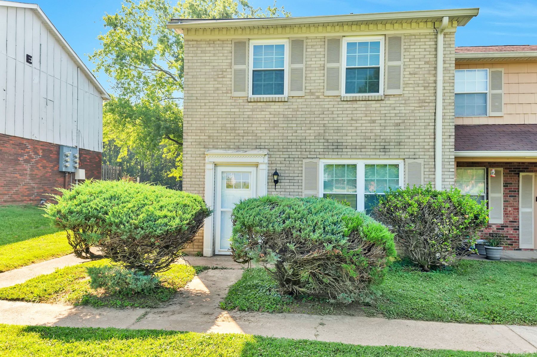 1301 Neelys Bend Road, Unit D27 Madison, TN 37115 - Photo 1 of 26 a front view of a house with garden