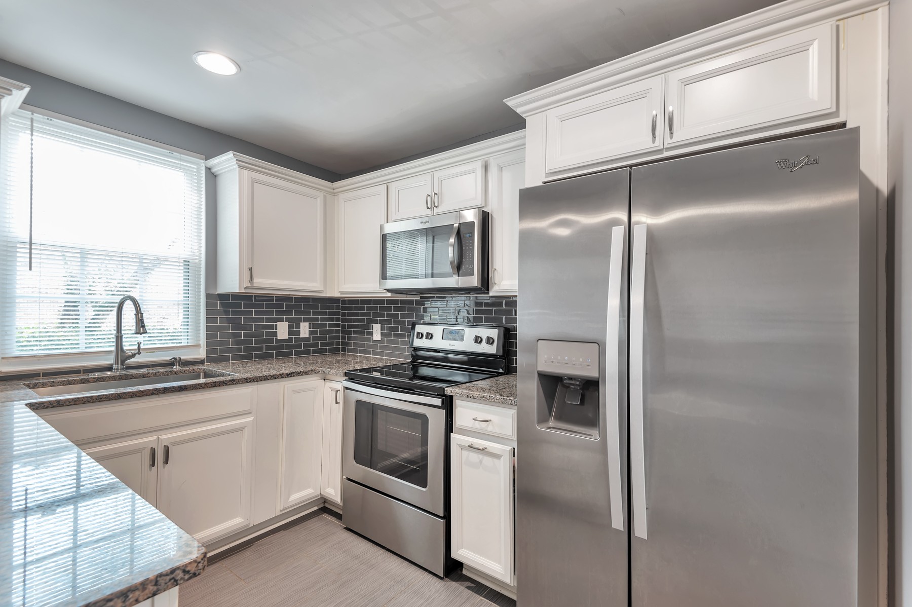 1301 Neelys Bend Road, Unit D27 Madison, TN 37115 - Photo 13 of 26 a kitchen with a refrigerator sink and cabinets