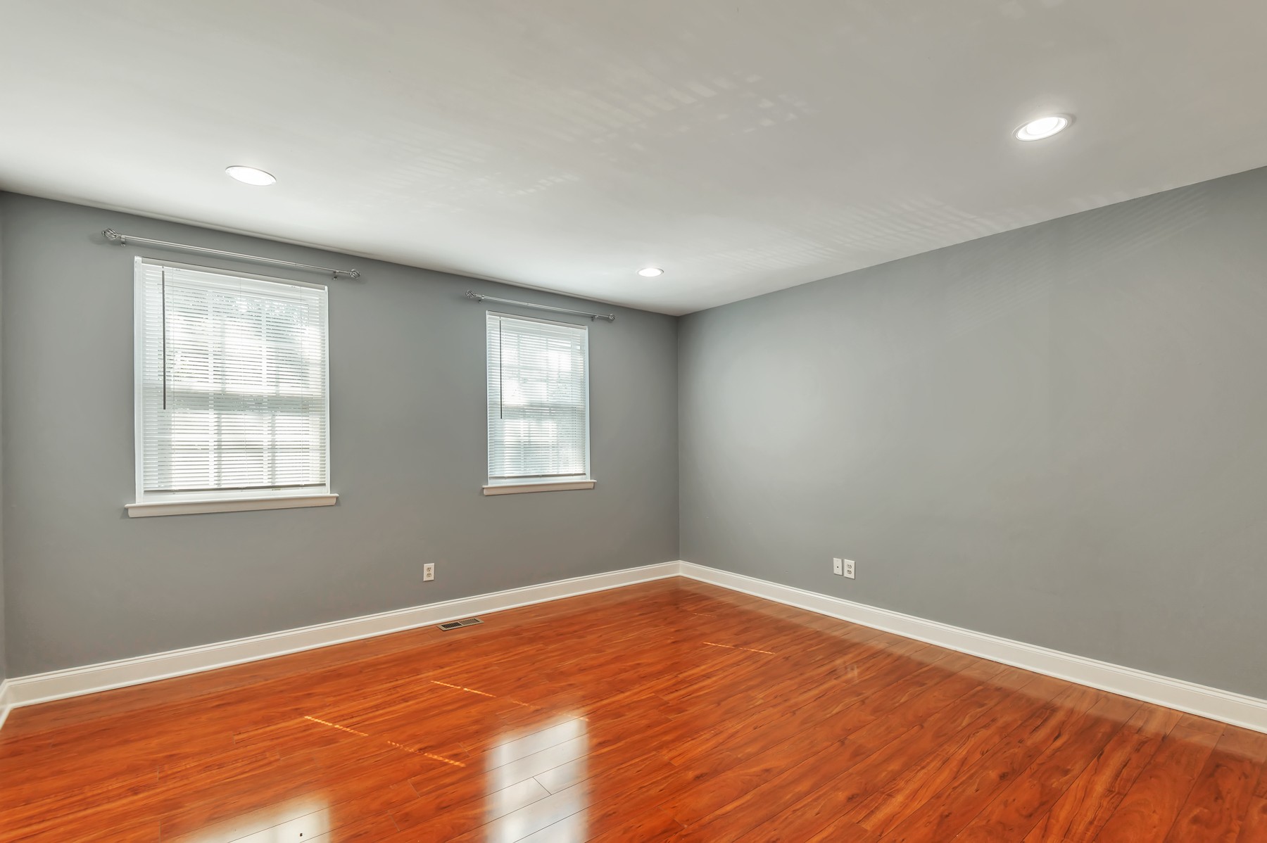1301 Neelys Bend Road, Unit D27 Madison, TN 37115 - Photo 16 of 26 an empty room with wooden floor and windows