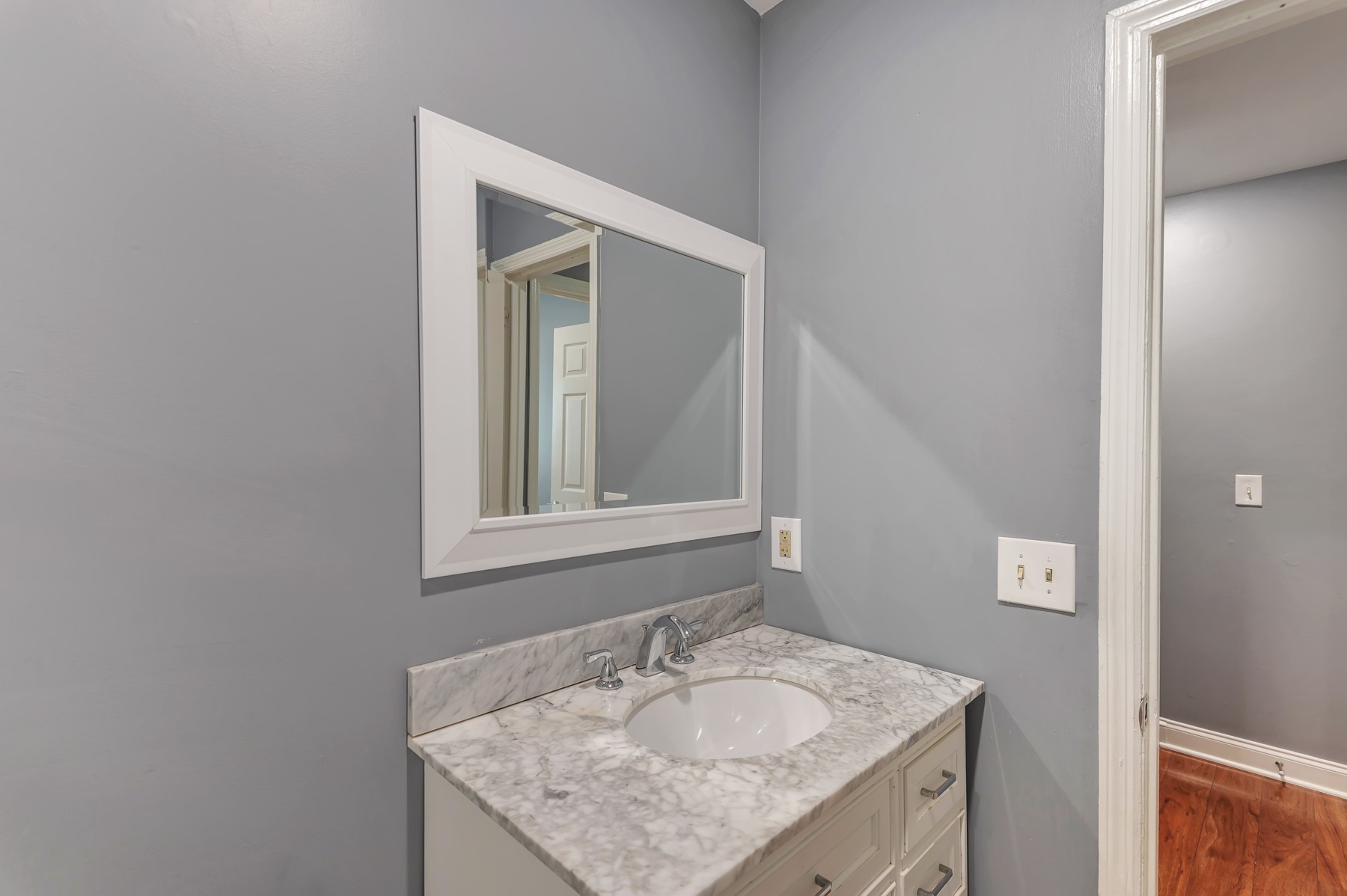 1301 Neelys Bend Road, Unit D27 Madison, TN 37115 - Photo 22 of 26 a bathroom with a granite countertop sink and a mirror