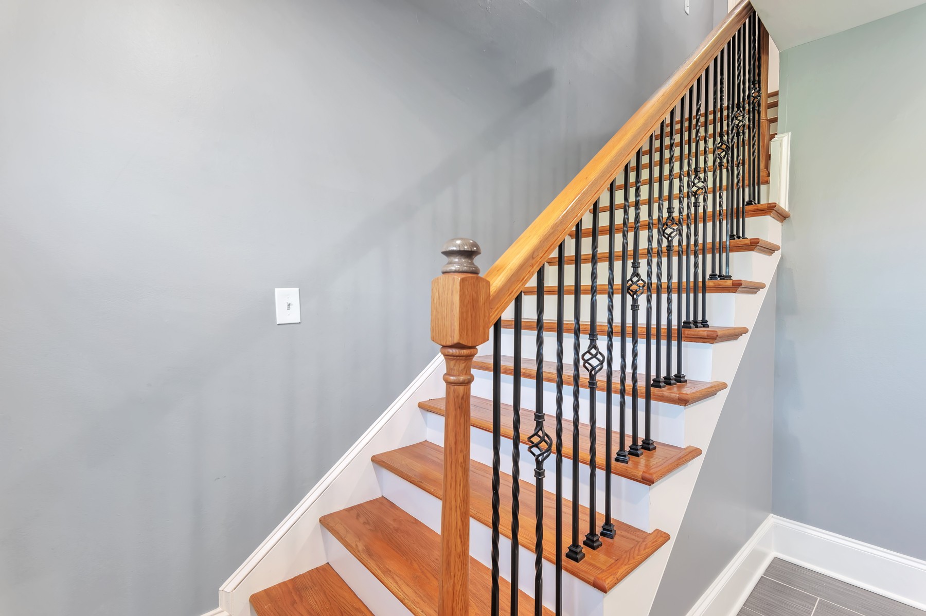 1301 Neelys Bend Road, Unit D27 Madison, TN 37115 - Photo 5 of 26 a view of staircase with wooden floor and white walls