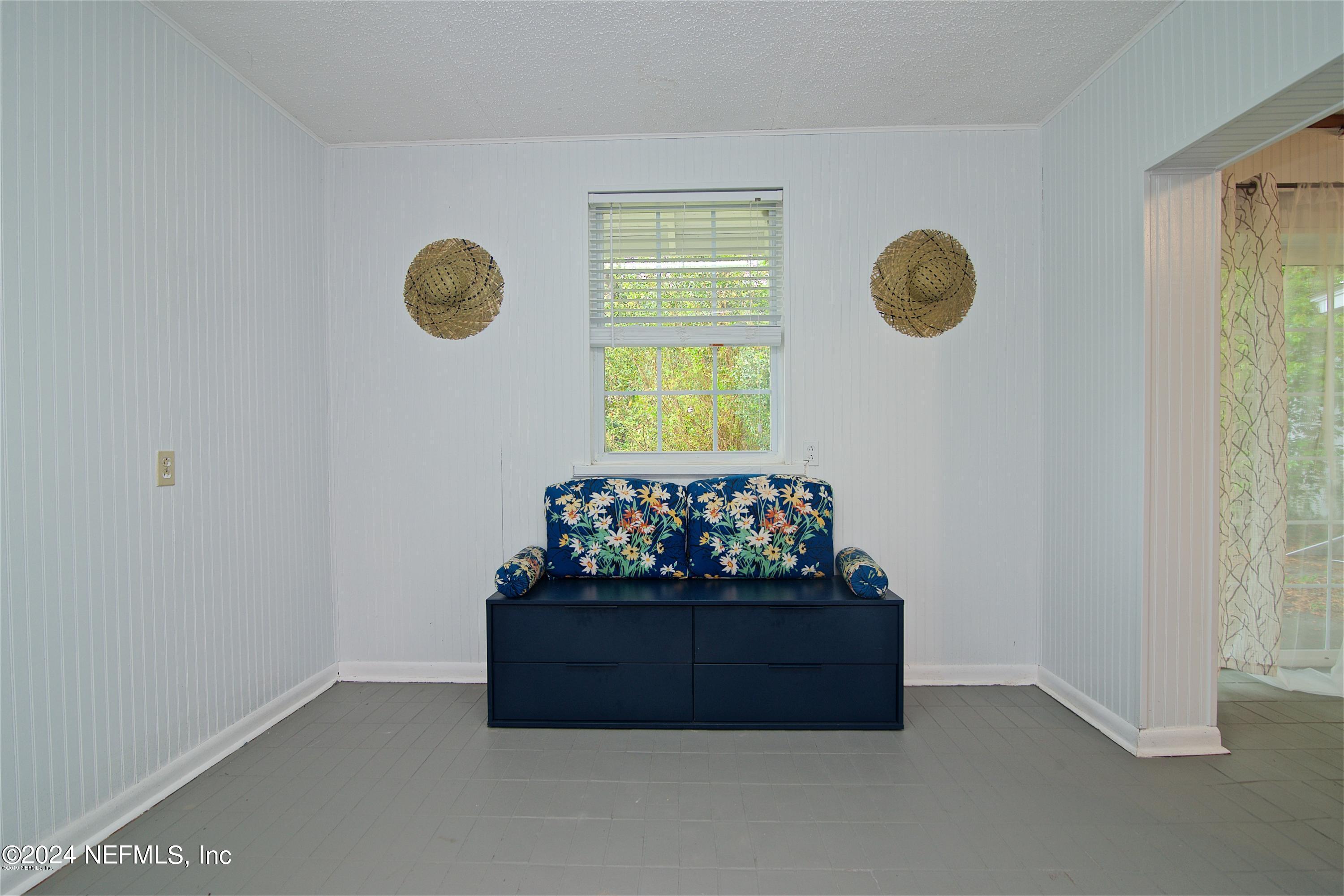 1938 Biggers Road Jacksonville, FL 32216 - Photo 19 of 25 a room with a mirror and fan