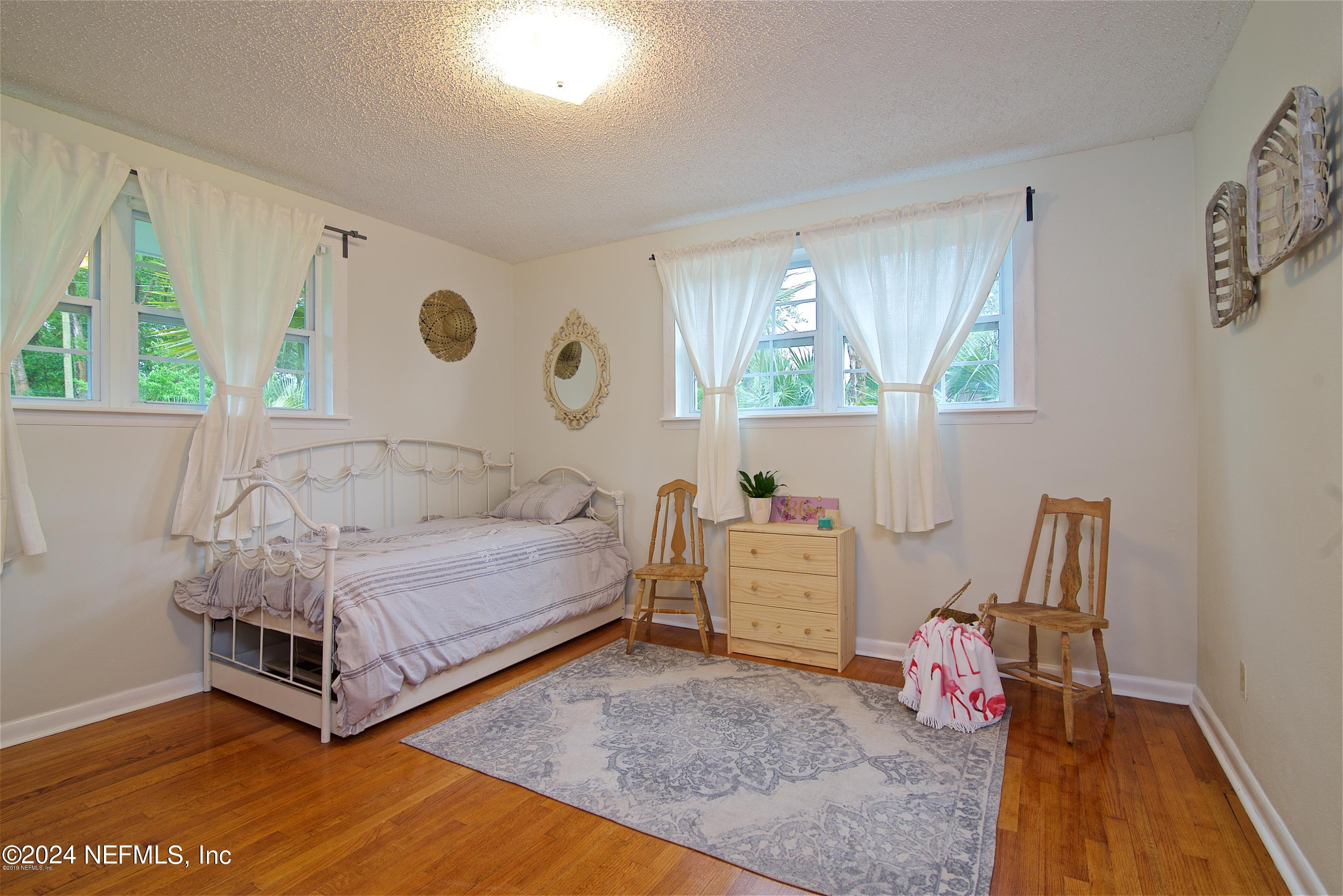 1938 Biggers Road Jacksonville, FL 32216 - Photo 21 of 25 a living room with furniture and a large window