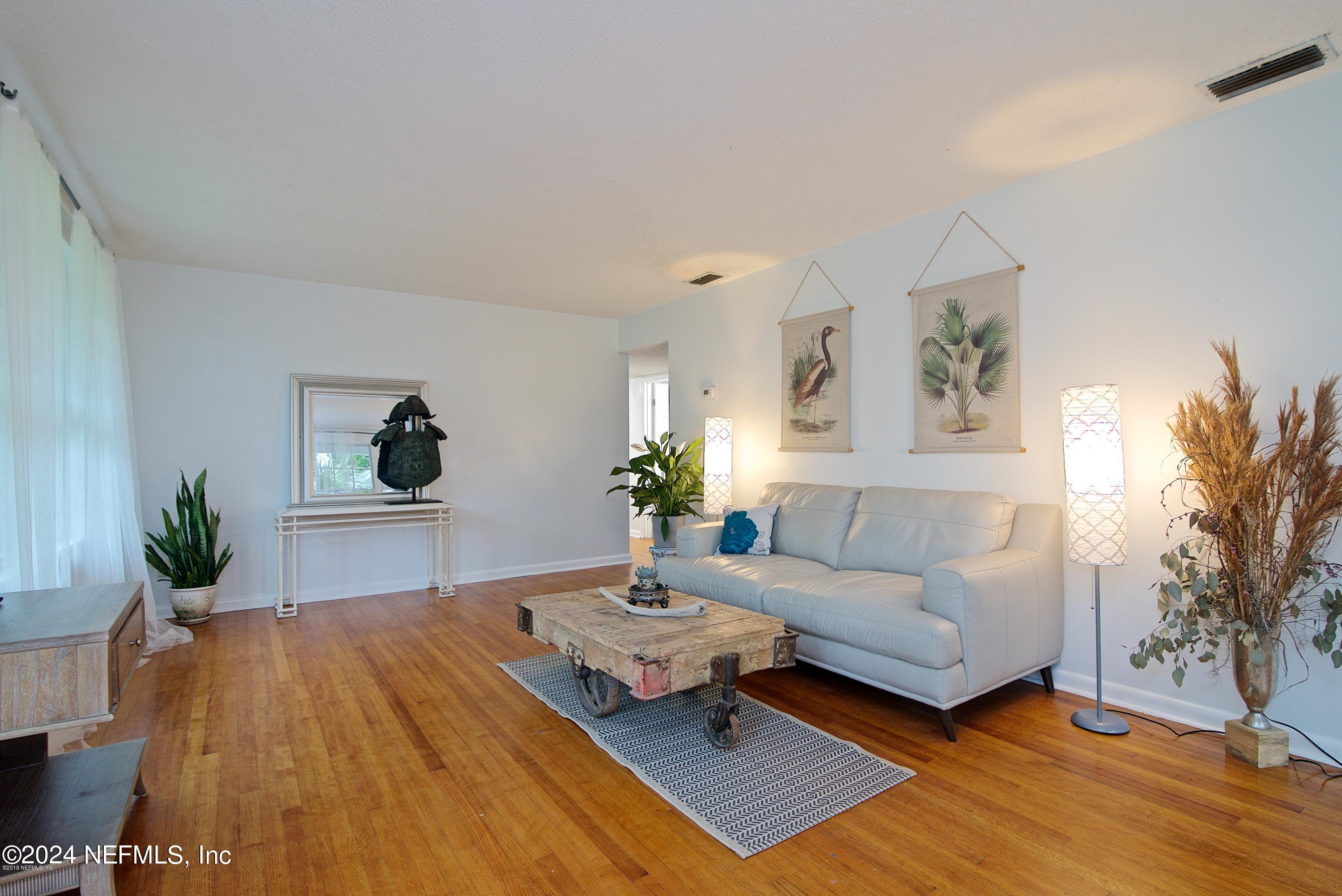1938 Biggers Road Jacksonville, FL 32216 - Photo 3 of 25 a living room with furniture and a potted plant