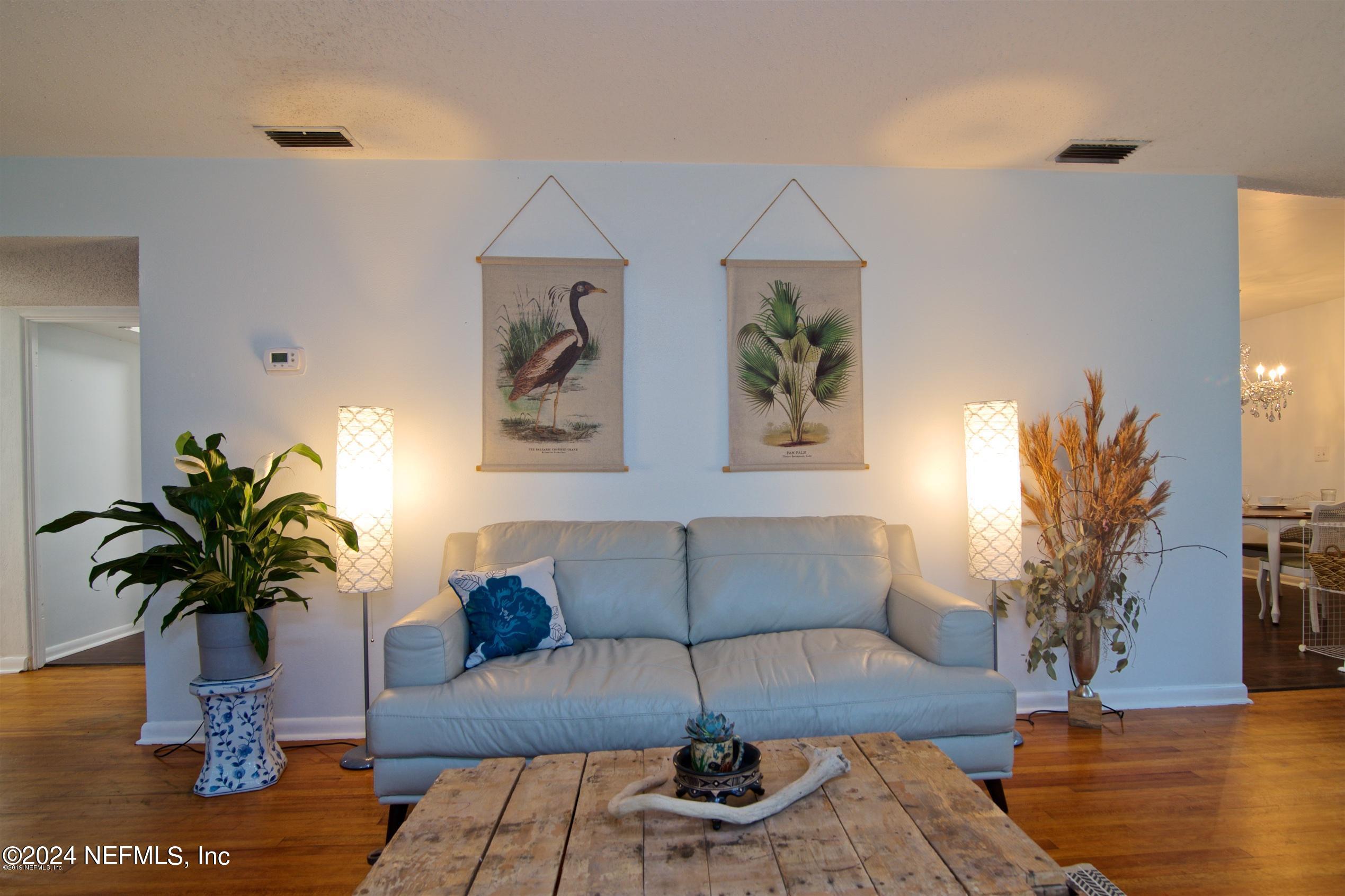 1938 Biggers Road Jacksonville, FL 32216 - Photo 5 of 25 a living room with furniture potted plant and wooden floor