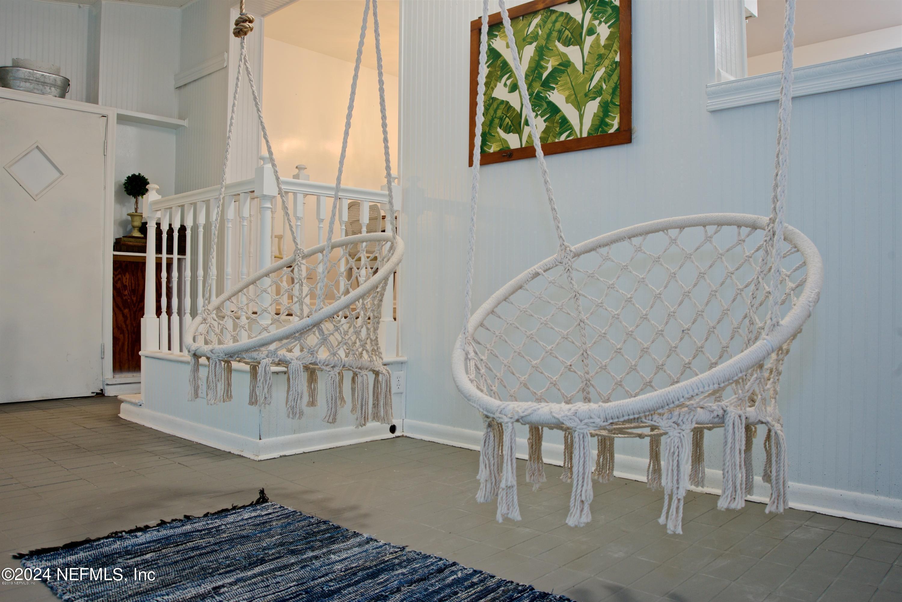 1938 Biggers Road Jacksonville, FL 32216 - Photo 6 of 25 a view of staircase with a table and chairs