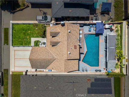 an aerial view of houses with outdoor space