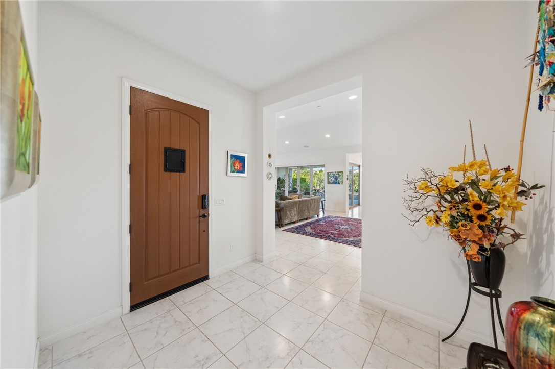7774 Kingdom Drive Riverside, CA 92506 - Photo 16 of 66 a view of entryway with flower plant