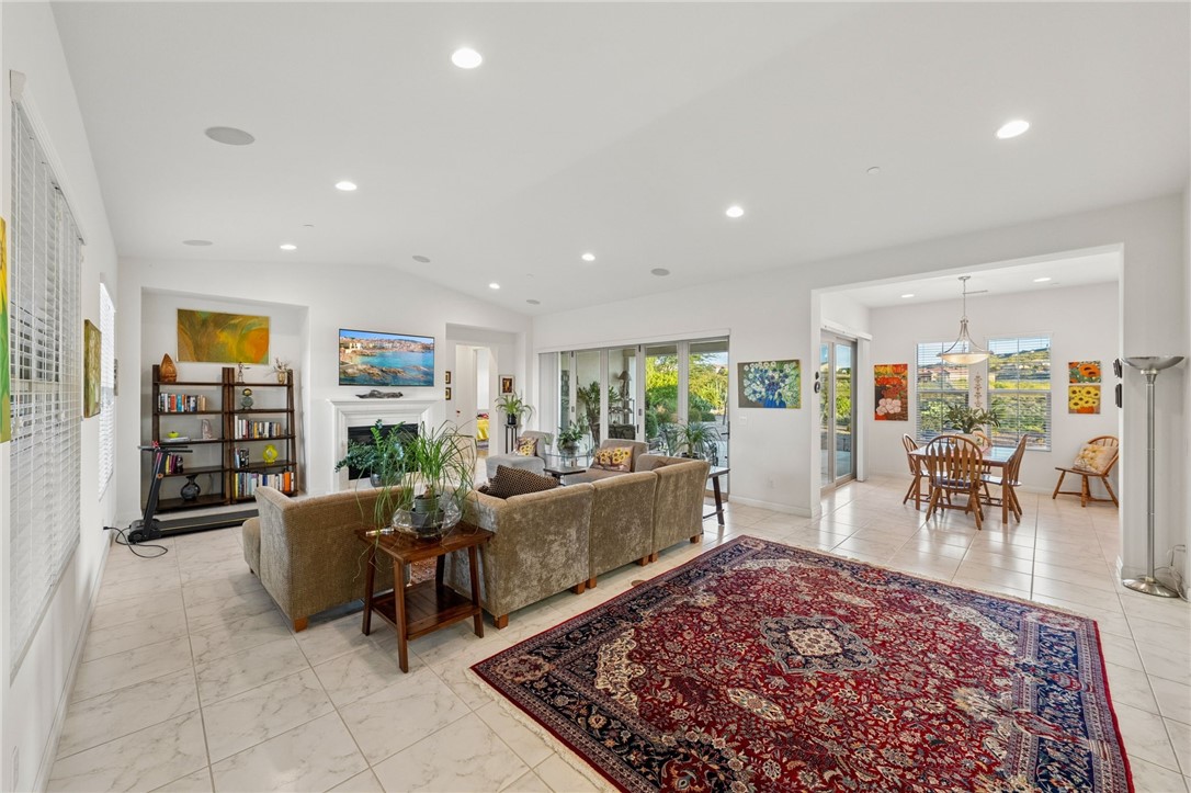 7774 Kingdom Drive Riverside, CA 92506 - Photo 25 of 66 a living room with furniture a rug and a floor to ceiling window
