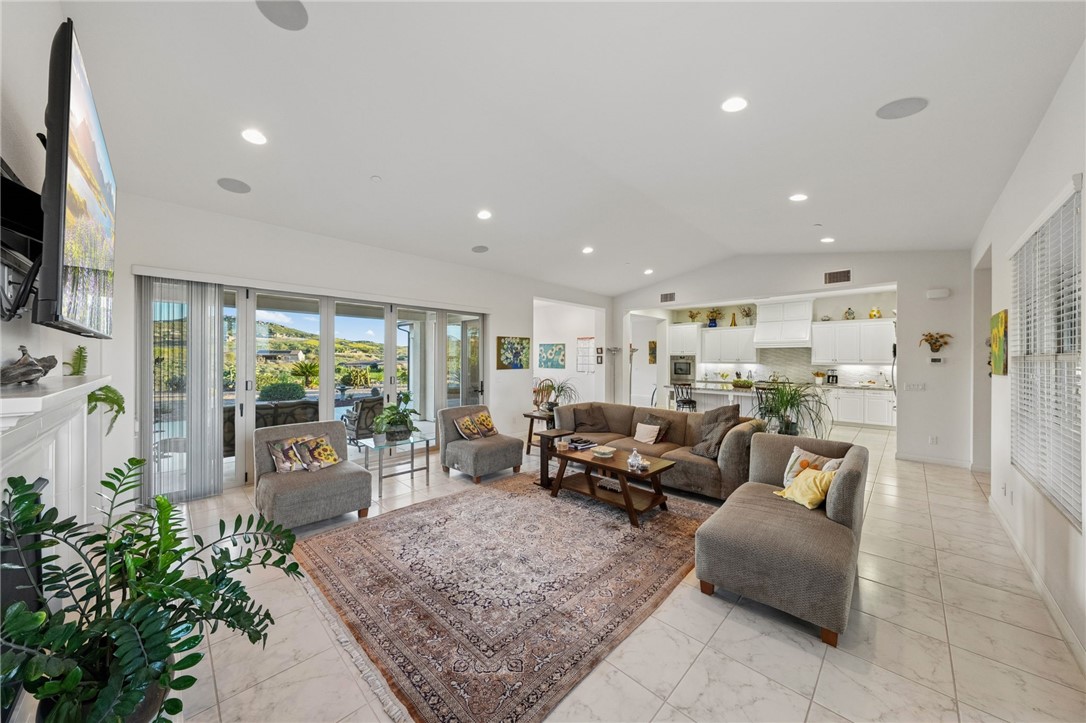 7774 Kingdom Drive Riverside, CA 92506 - Photo 26 of 66 a living room with furniture and a flat screen tv