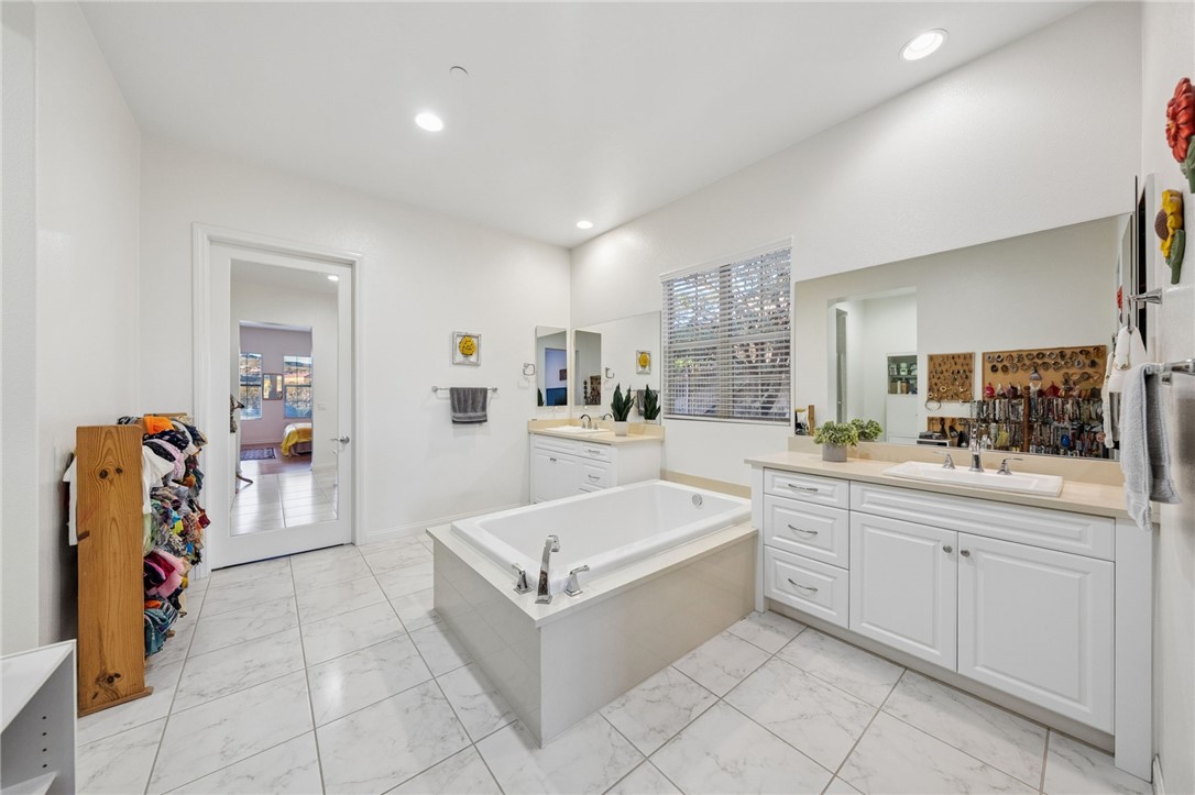 7774 Kingdom Drive Riverside, CA 92506 - Photo 29 of 66 a large white room with a large mirror and sink
