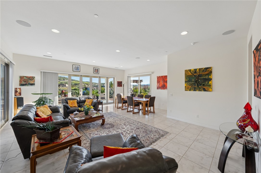 7774 Kingdom Drive Riverside, CA 92506 - Photo 33 of 66 a living room with furniture and a flat screen tv