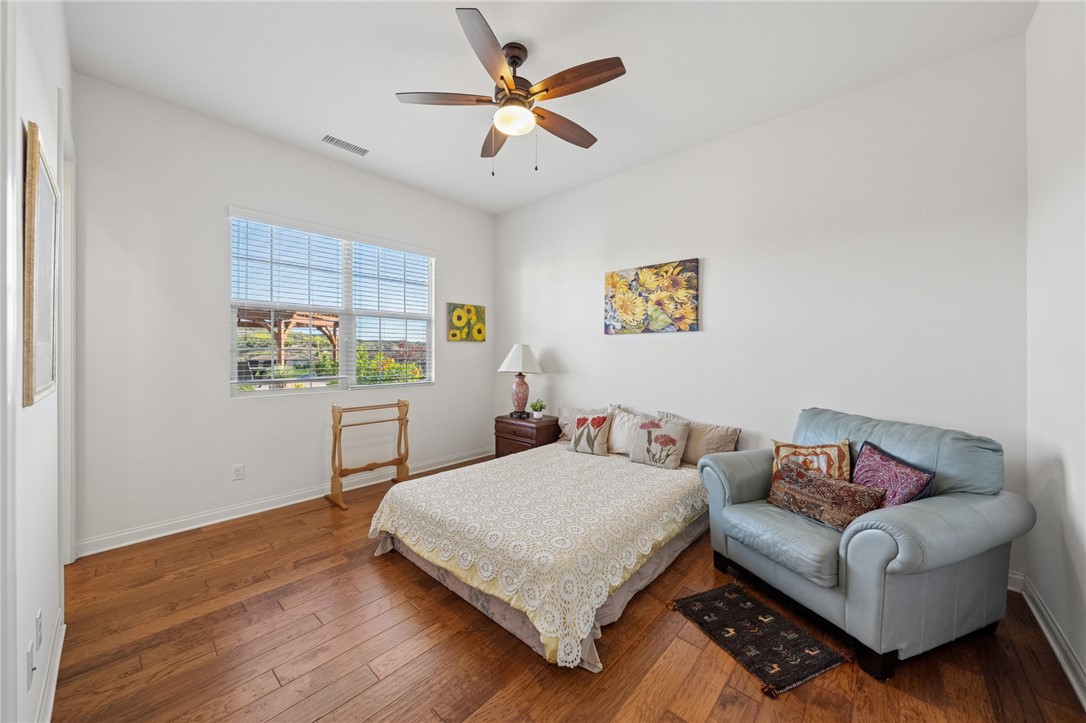 7774 Kingdom Drive Riverside, CA 92506 - Photo 39 of 66 a living room with furniture and a book shelf