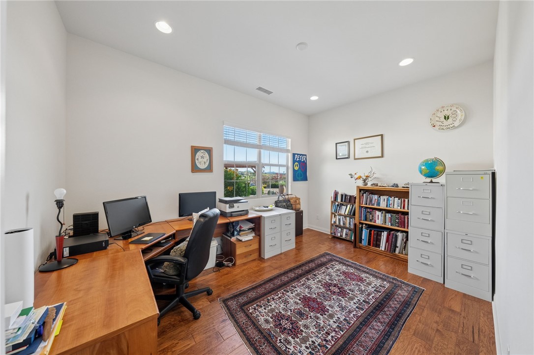 7774 Kingdom Drive Riverside, CA 92506 - Photo 40 of 66 a view of a workspace with furniture and a rug