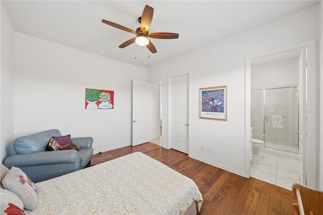 7774 Kingdom Drive Riverside, CA 92506 - Photo 41 of 66 a bedroom with a large bed and a chandelier