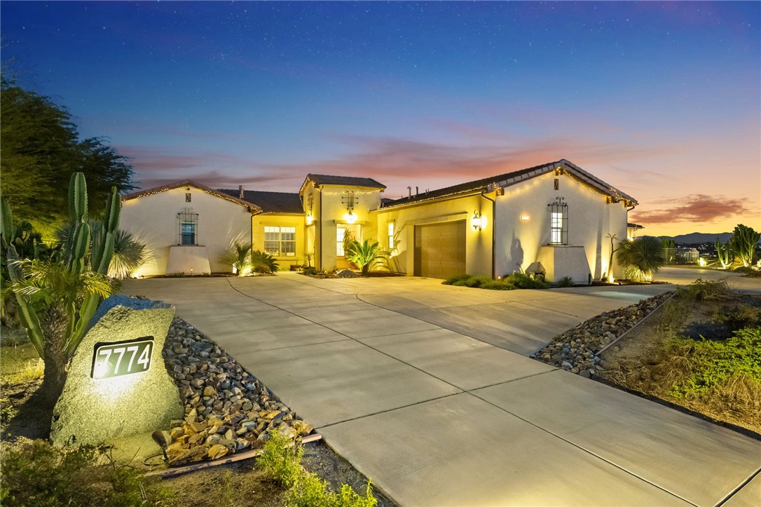 7774 Kingdom Drive Riverside, CA 92506 - Photo 8 of 66 a front view of a house with a yard