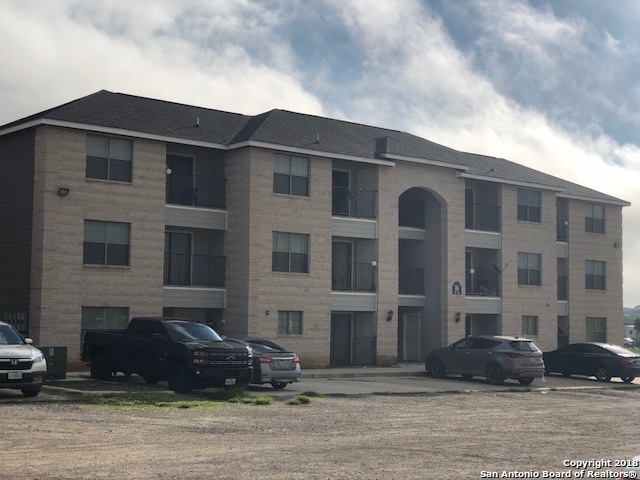 112 Lone Oak, Unit D102 Floresville, TX 78114 - Photo 1 of 34 a front view of a building