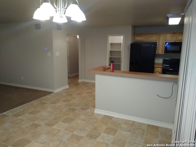 112 Lone Oak, Unit D102 Floresville, TX 78114 - Photo 11 of 34 en empty room with wooden floor