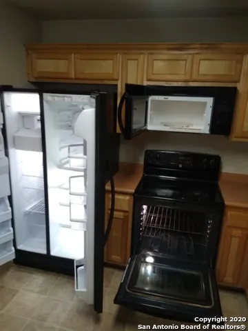 a kitchen with sink and cabinets